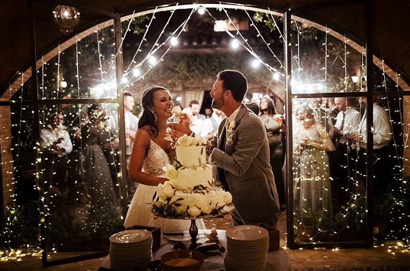 Stephanie MacLaughlin And Zachary Newell Couple Feeding Eachother Cake