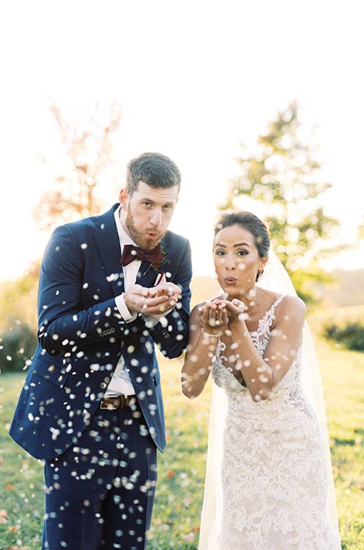 Kimberly Hernandez & Michael Kelly Couple Blowing Flowers