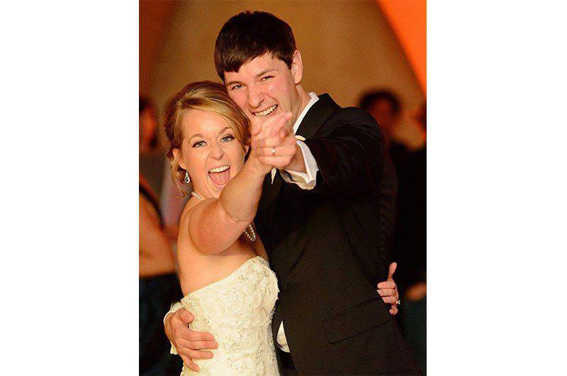 The Barefoot Bride strapless dancing couple looking at camera