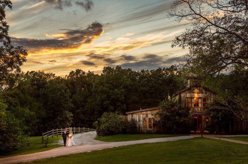 Heartwood Hall bride groom barn outside sunset