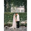 Alys Beach couple love white tuxedo wedding dress