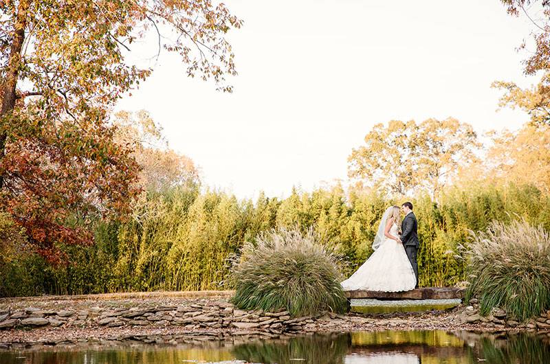 Lake At Heartwood Hall Outdoors by Trees bride and groom