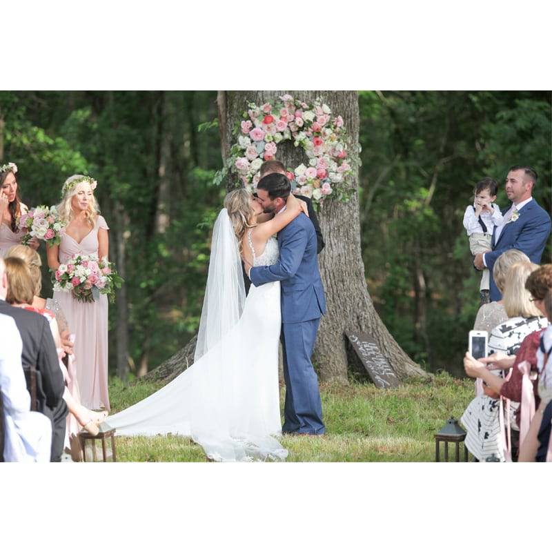 FV Russell Lands Couple Kissing Outdoor Ceremony
