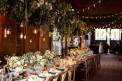 Fete Nashville table setting hanging eucalyptus arrangements with handling lights