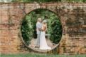 Brick Wall Cedar Hall Bride Groom together