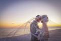Hilton San Destin Couple Kissing On Beach Under Veil