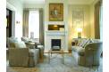 The Stratton House parlor couches by fireplace