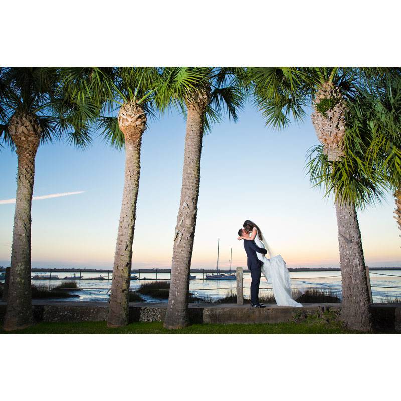 Golden Isles Georgia Man Picking Woman Up Under Palm Trees