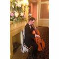 Simply Strings Celloist Performing by fireplace