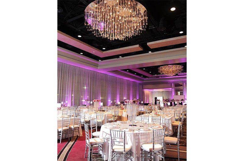 weddings_Weddings by Lulu ballroom reception hall chandelier round tables silver chairsy_lulu-ballroom_reception