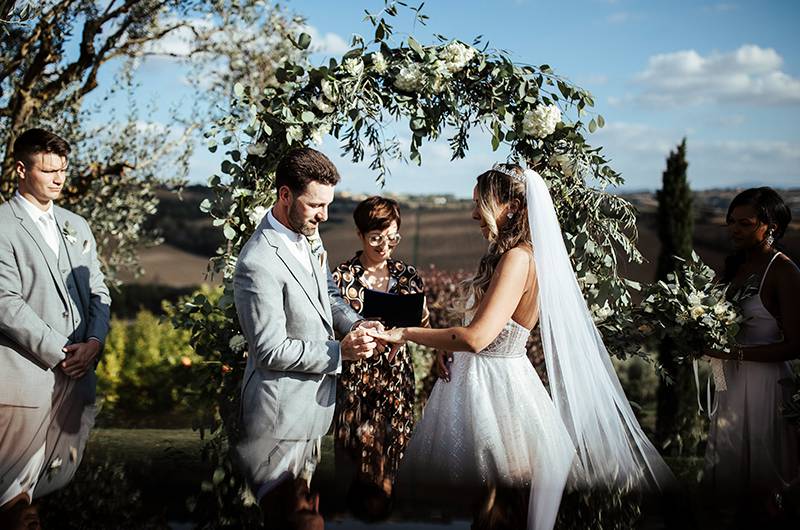 Stephanie MacLaughlin And Zachary Newell Exchanging Rings