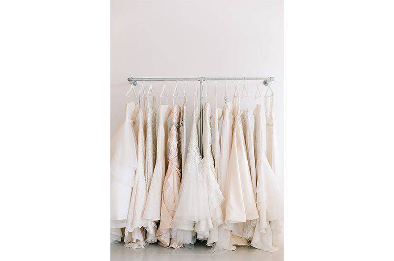 Maggie Louise Bridal bridal dresses hanging on rack