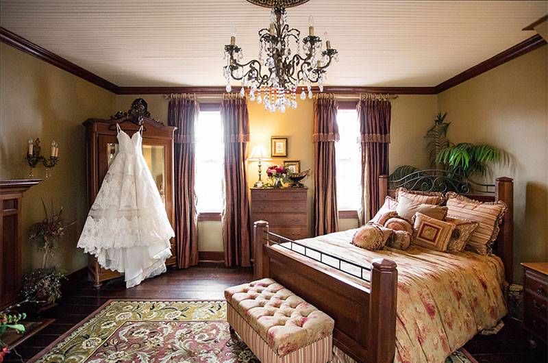 Bedroom At Heartwood Hall Brides Dress hanging