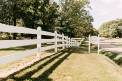 Heartwood hall white rail fence venue sign