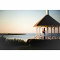 Golden Isles Georgia Couple Standing In Gazebo Looking Out Over Water