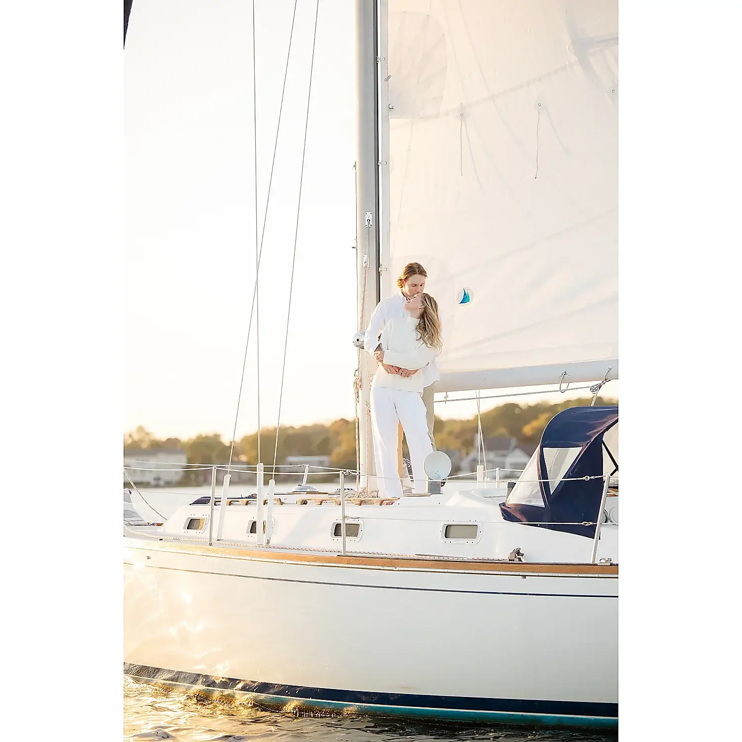 Susan Elizabeth Photography romantic couple sailboat calm water golden hour idyllic Florida Wedding Photography