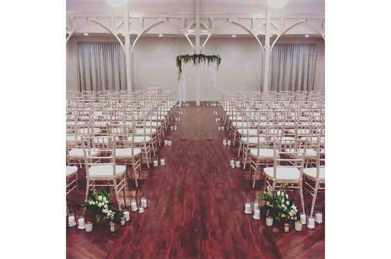 The Atrium wedding ceremony aisle with seating chairs
