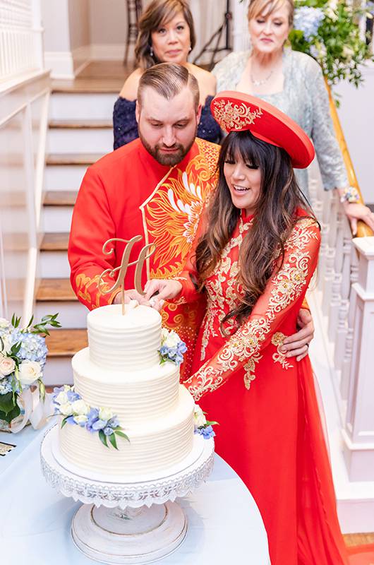 Emily Nguyen And Chase Henckel Cutting The Cake