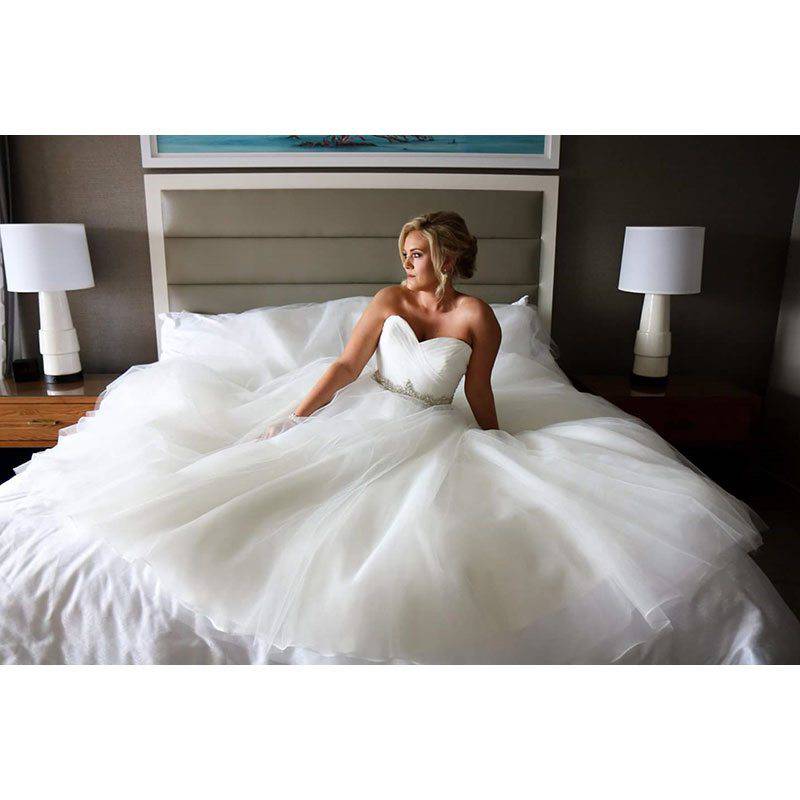 Sheraton Bay Point Resort bride on bed